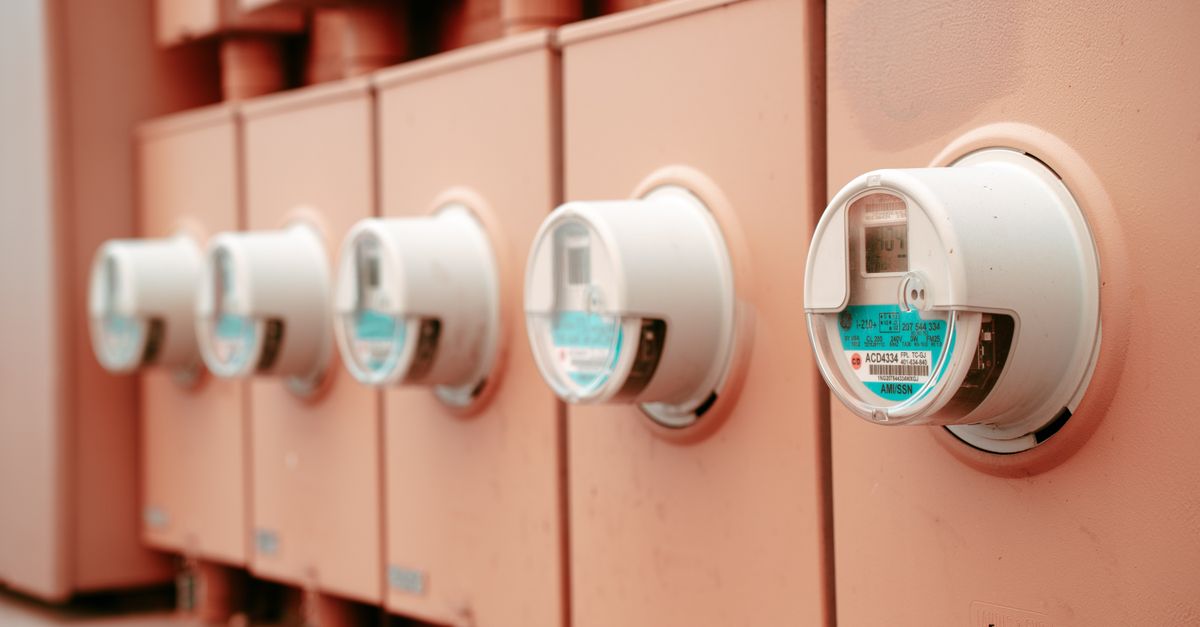 A row of electricity meters mounted on a wall