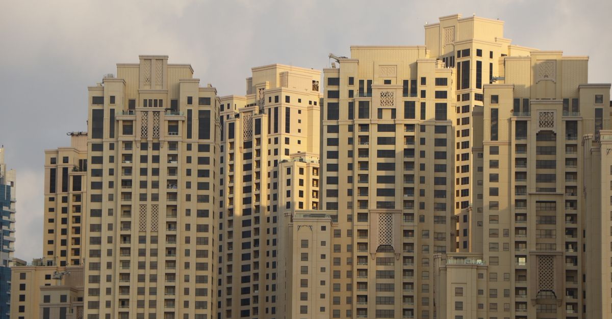 High-rise residential towers in Dubai photographed from below