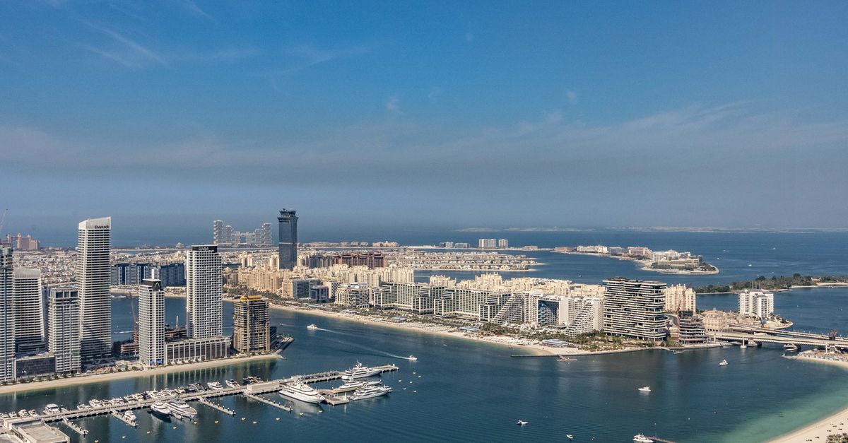 Aerial view of the Dubai Marina skyline and Palm Jumeirah on a clear day
