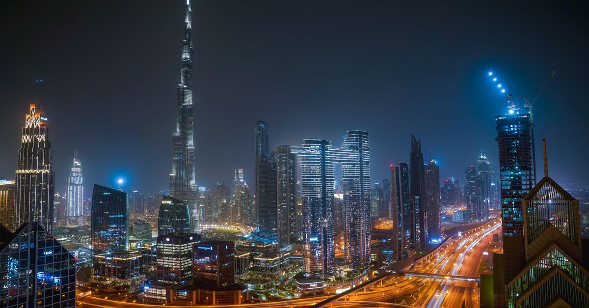 Dubai's illuminated skyline at night seen from above