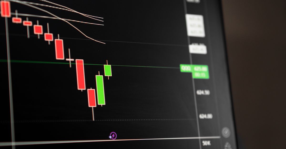 A candlestick chart showing a downward trend on a trading screen