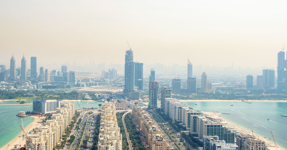 View along the trunk of Palm Jumeirah towards the Dubai Marina skyline