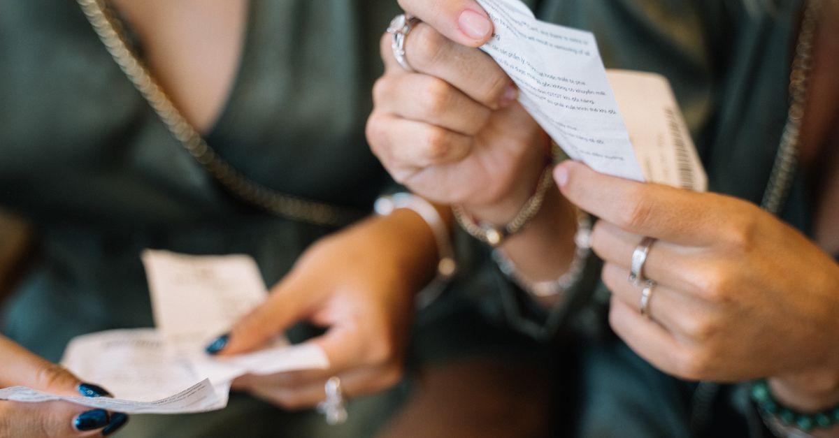 Two people going through receipts together