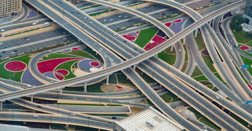 Aerial view of a landscaped highway interchange in Dubai